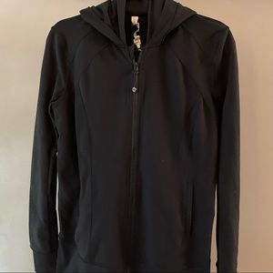 This lululemon zip up jacket is black! The pink photo is for style reference.